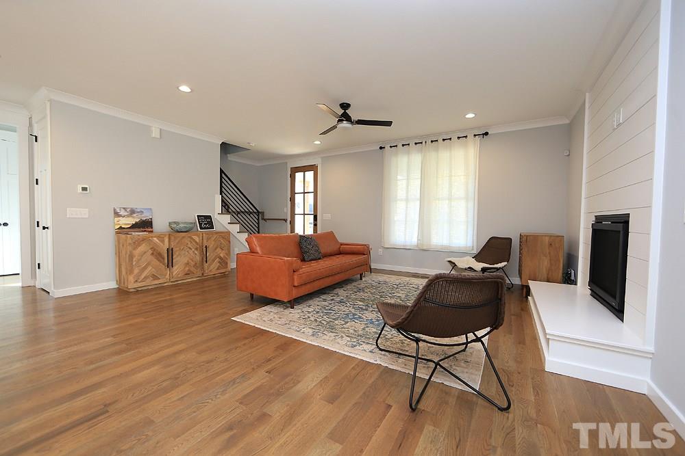 521 Bart Street Raleigh, NC 27610 - Photo 7 of 29 a living room with furniture and a flat screen tv