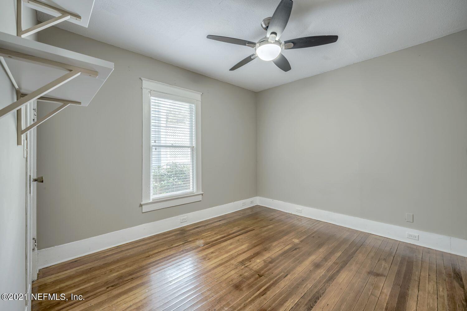 2835 Post Street Jacksonville, FL 32205 - Photo 11 of 30 a view of an empty room with wooden floor and a window