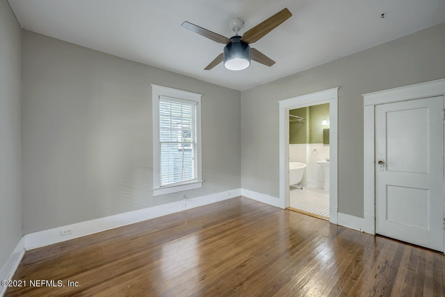 2835 Post Street Jacksonville, FL 32205 - Photo 13 of 30 an empty room with wooden floor and windows