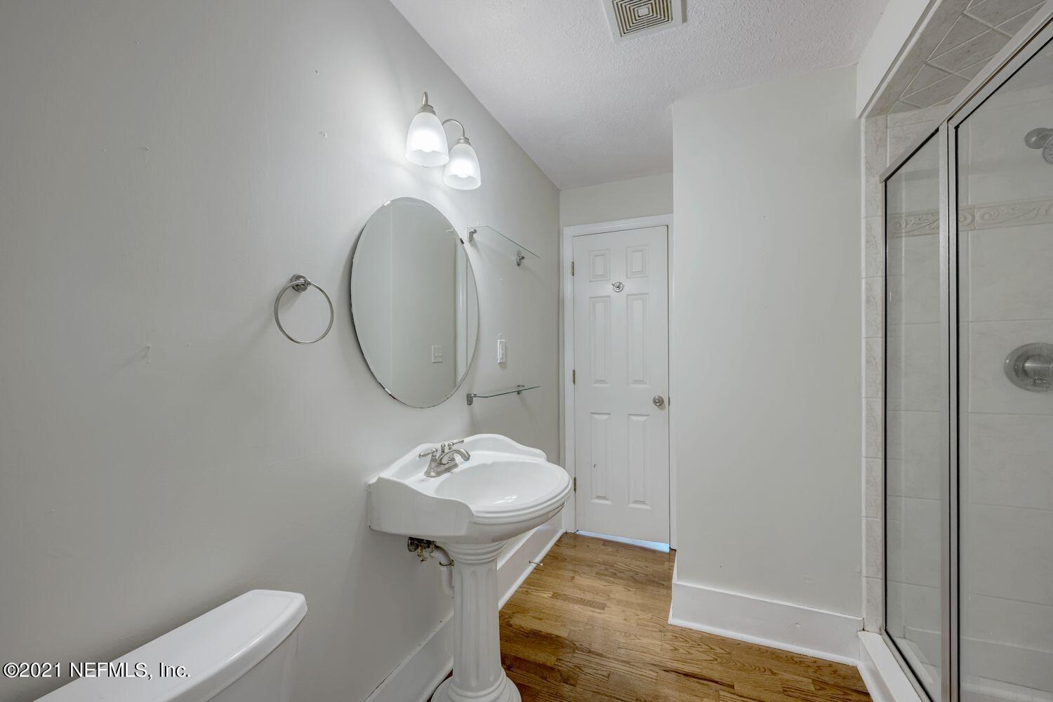2835 Post Street Jacksonville, FL 32205 - Photo 16 of 30 a bathroom with a sink toilet and mirror
