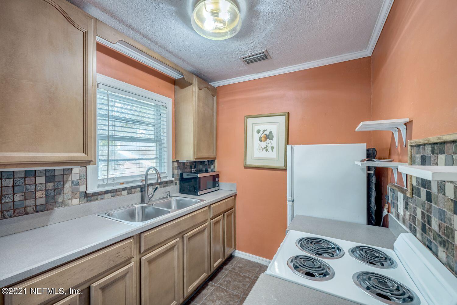 2835 Post Street Jacksonville, FL 32205 - Photo 25 of 30 a kitchen that has a sink and a stove top oven