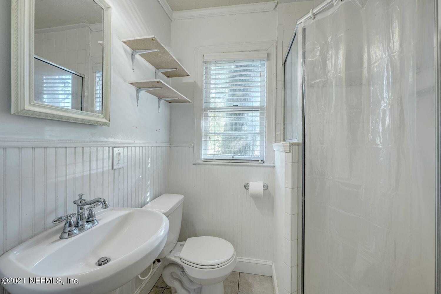 2835 Post Street Jacksonville, FL 32205 - Photo 27 of 30 a bathroom with a sink toilet and a mirror