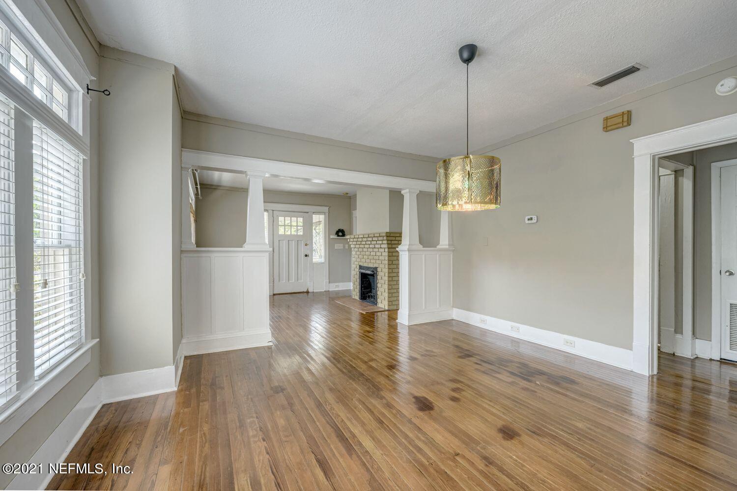 2835 Post Street Jacksonville, FL 32205 - Photo 6 of 30 a view of a hallway with wooden floor and a chandelier