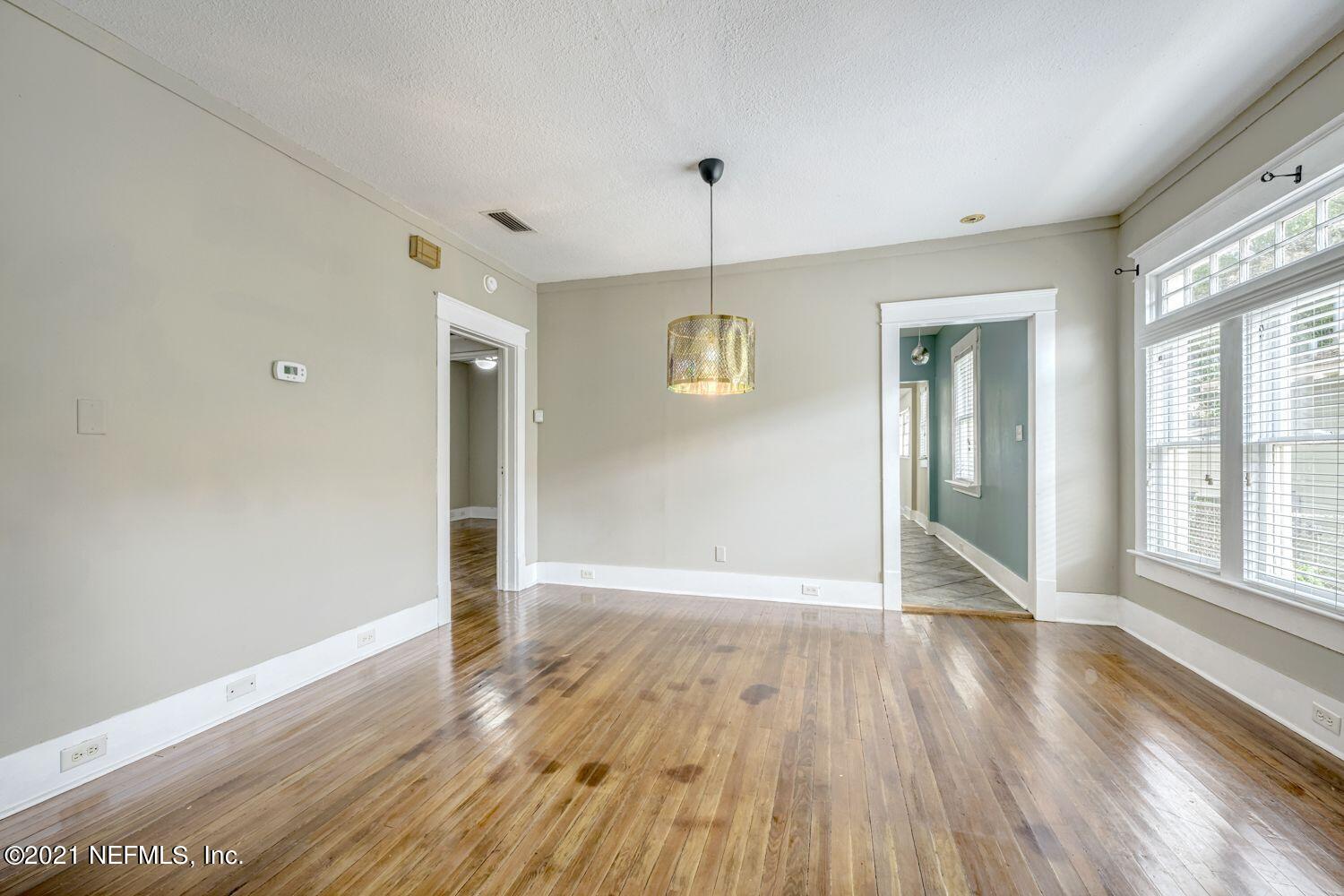 2835 Post Street Jacksonville, FL 32205 - Photo 8 of 30 a view of an empty room with wooden floor and a window