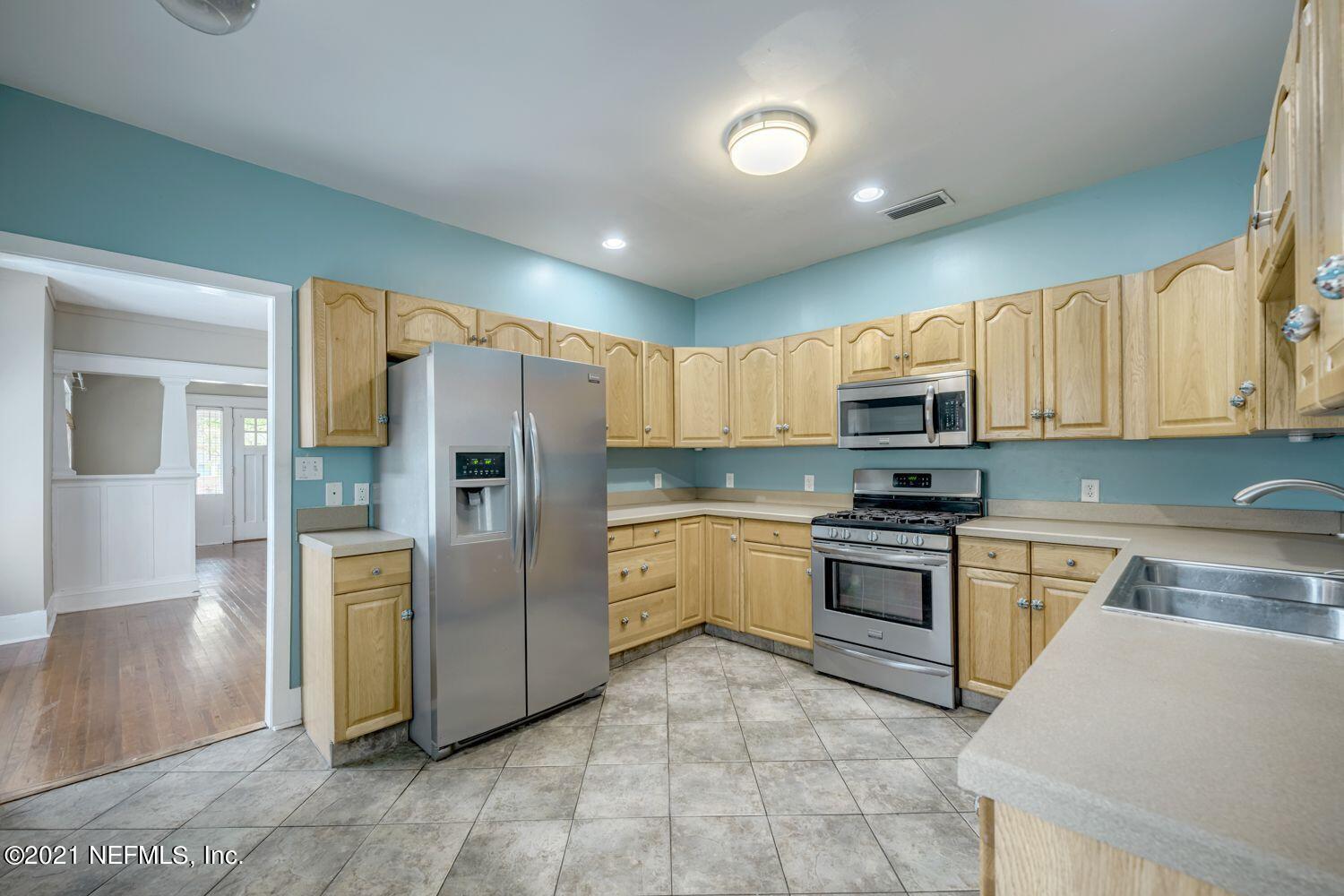 2835 Post Street Jacksonville, FL 32205 - Photo 9 of 30 a kitchen with stainless steel appliances granite countertop a refrigerator and a stove top oven