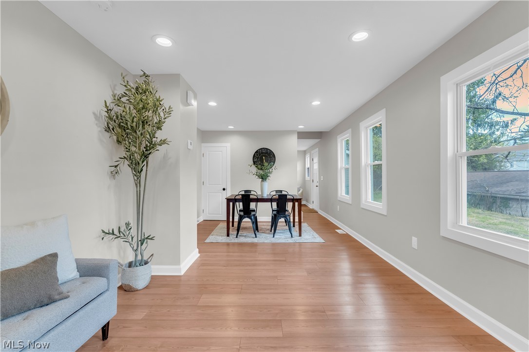 18155 Libby Road Maple Heights, OH 44137 - Photo 13 of 32 Bright interior space featuring light wood-finish flooring, recessed lighting, and multiple windows with white trim
