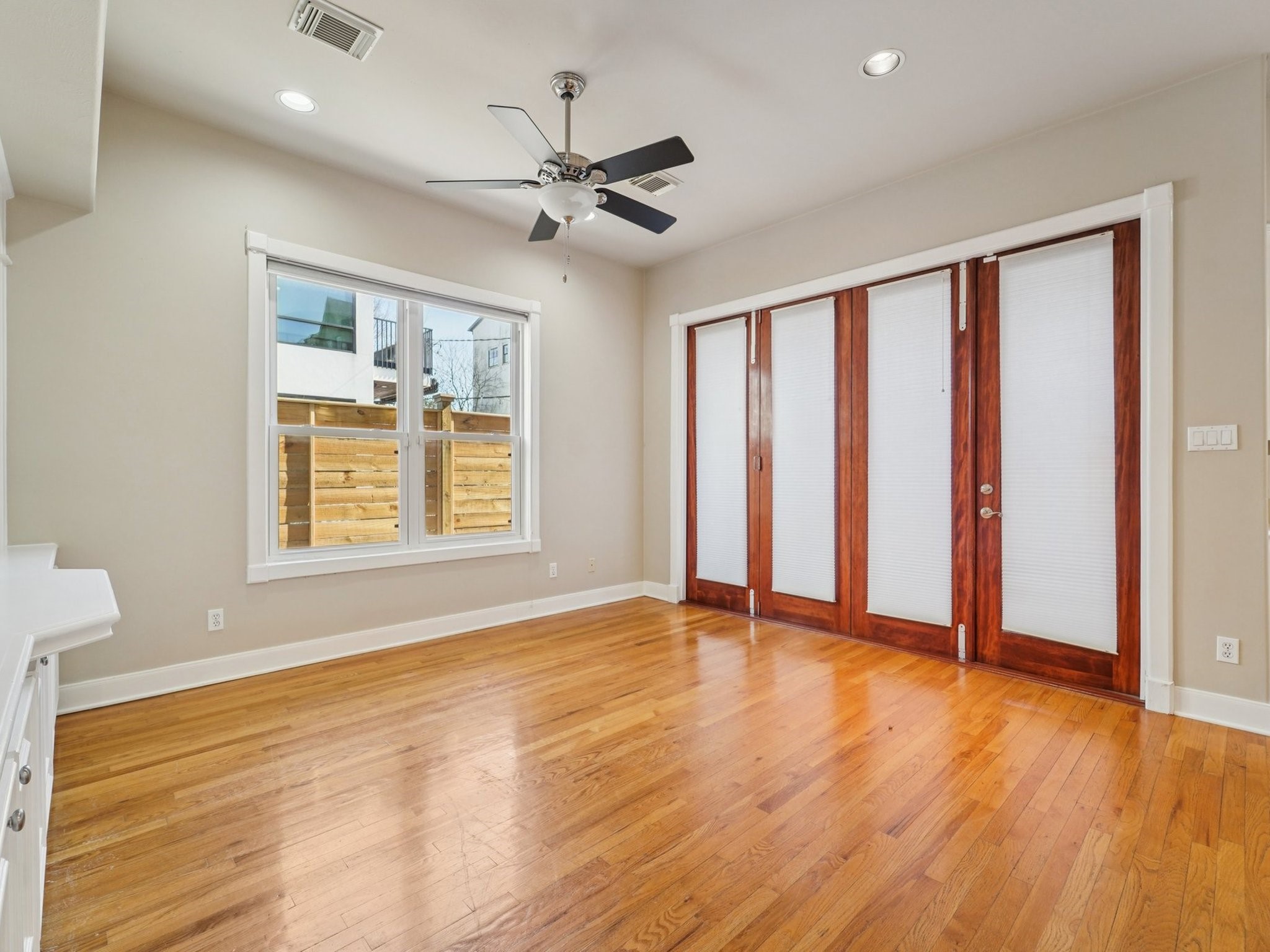 1951 West Clay Street Houston, TX 77019 - Photo 9 of 49 The Family Room features tri-fold doors that lead to the backyard.