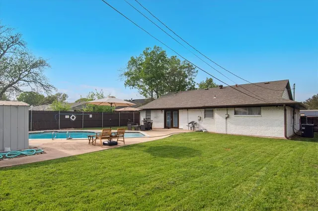 a view of a house with a yard porch and sitting area