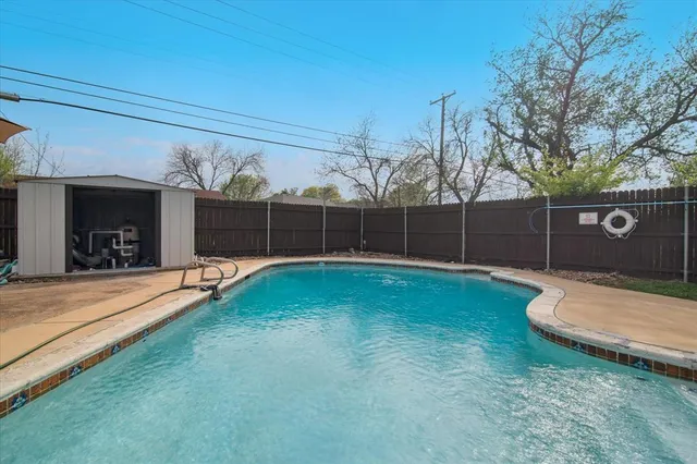 a view of a backyard with a small cabin
