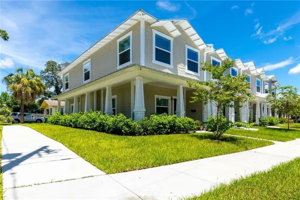 a front view of a house with a yard