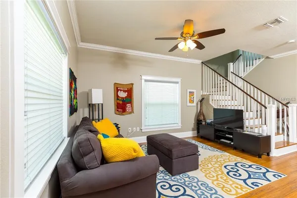 a living room with furniture and a flat screen tv