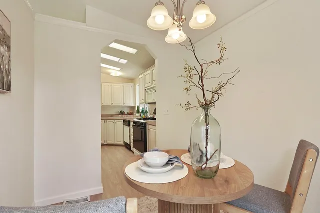 a kitchen with cabinets and window