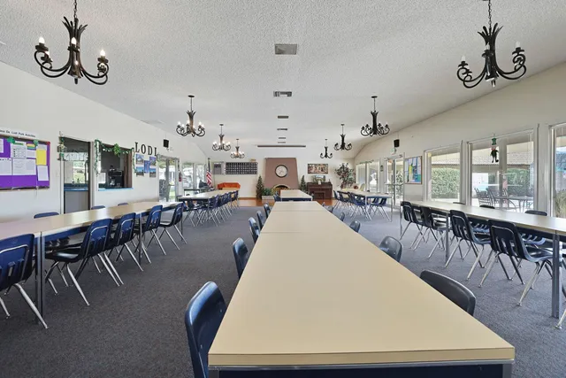 a view of a chairs and tables in the patio