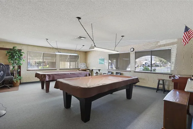 a kitchen with a stove and a refrigerator