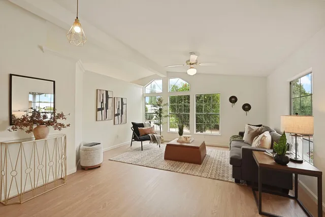 a living room with furniture and a table