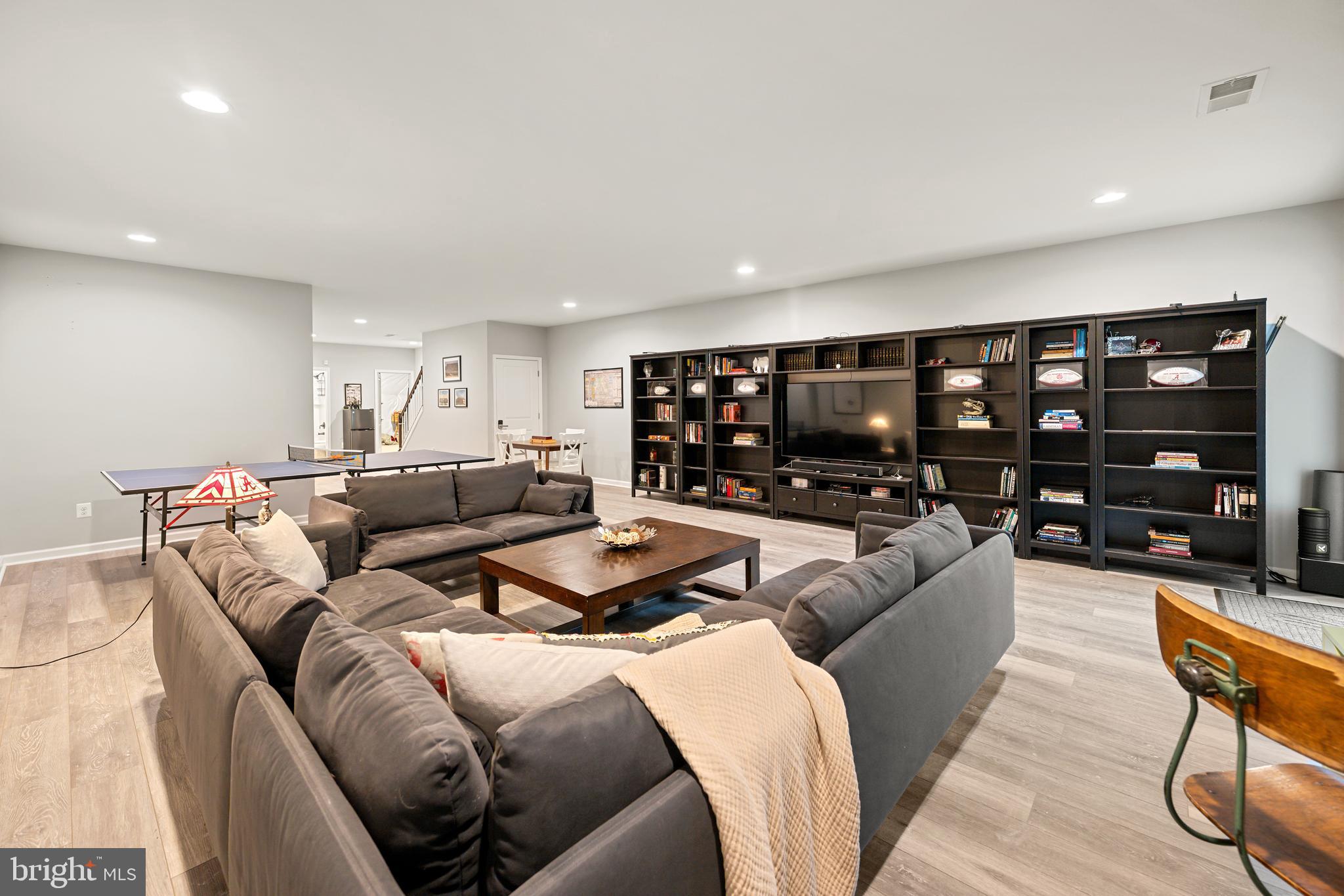 8459 Reformatory Way Lorton, VA 22079 - Photo 46 of 78 a living room with furniture and a flat screen tv