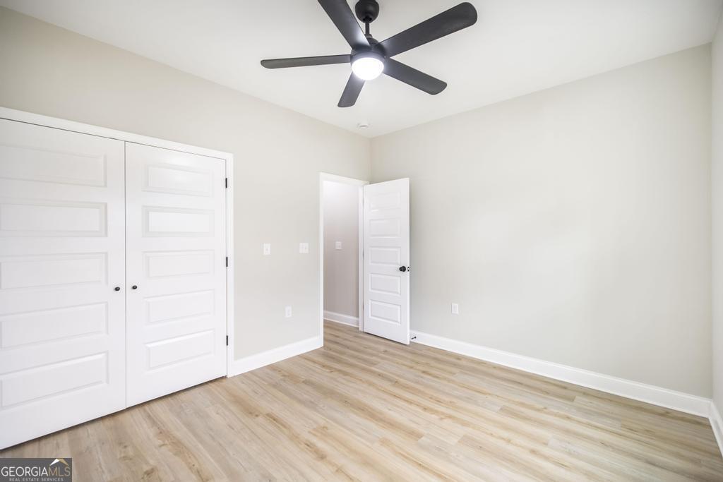 212 Lovett Farm Road East Dublin, GA 31027 - Photo 21 of 26 wooden floor in an empty room