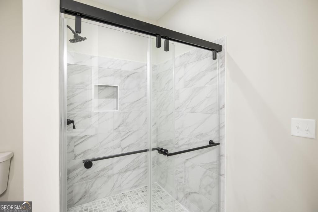 212 Lovett Farm Road East Dublin, GA 31027 - Photo 25 of 26 a bathroom with a shower and a shower