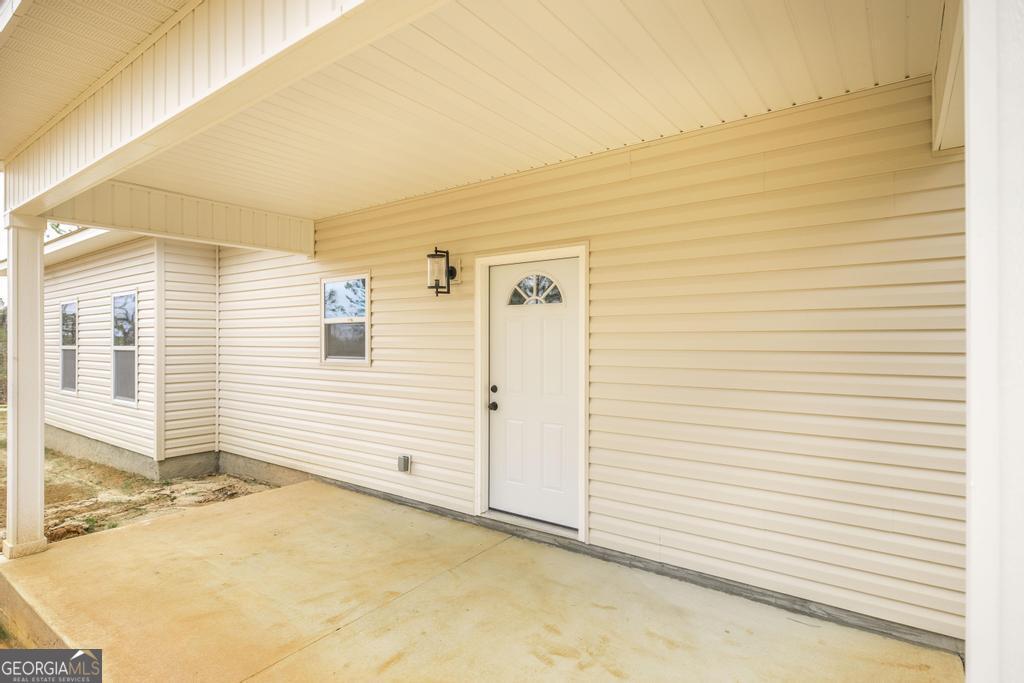212 Lovett Farm Road East Dublin, GA 31027 - Photo 7 of 26 a view of a house with a outdoor space