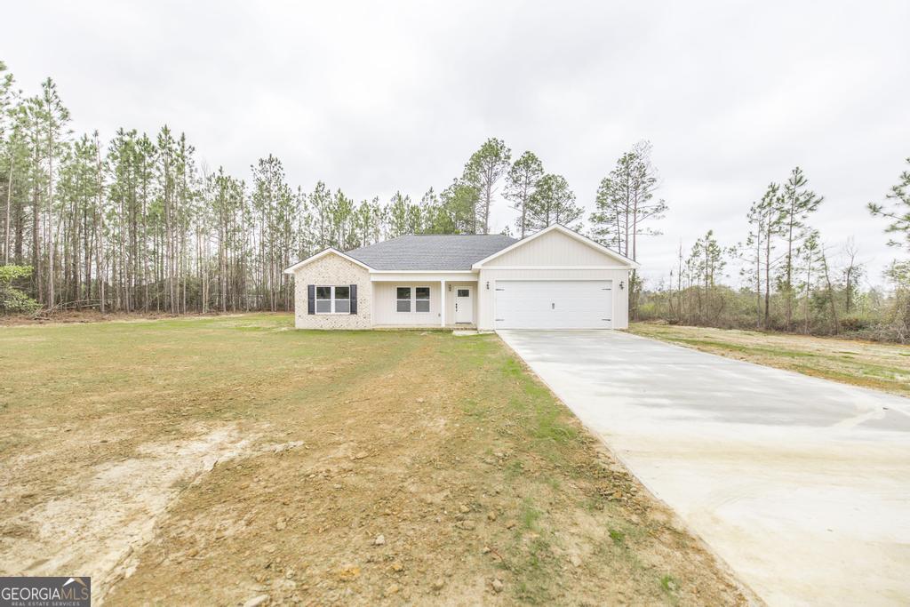 212 Lovett Farm Road East Dublin, GA 31027 - Photo 8 of 26 a house view with a outdoor space