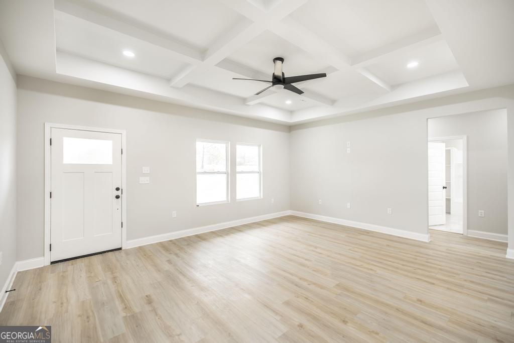 212 Lovett Farm Road East Dublin, GA 31027 - Photo 9 of 26 wooden floor in an empty room with a window