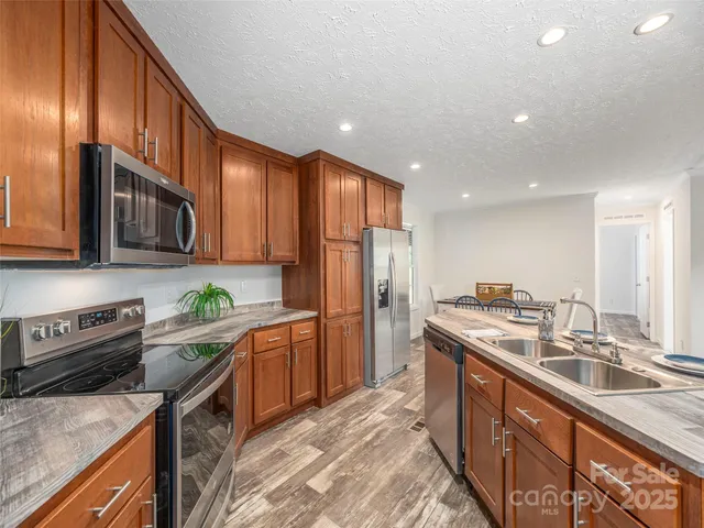 a view of a dining room with furniture and a window