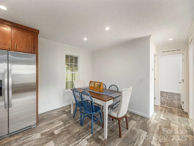 a view of a kitchen with sink cabinets and natural light