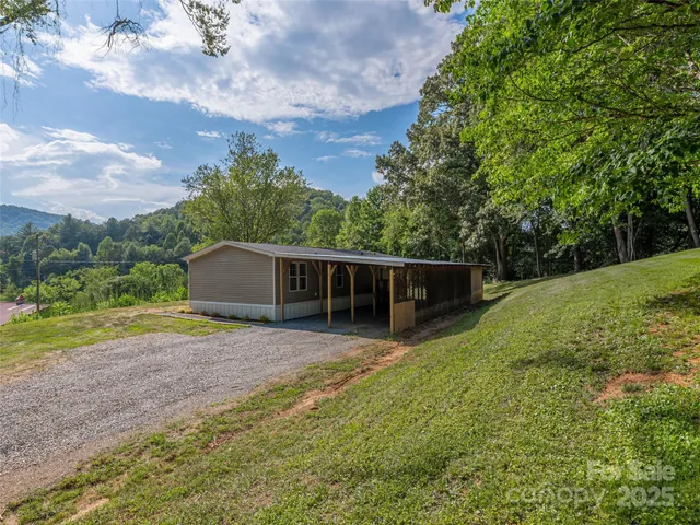 a backyard of a house with lots of green space