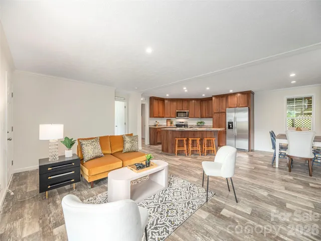 a living room with furniture and a table