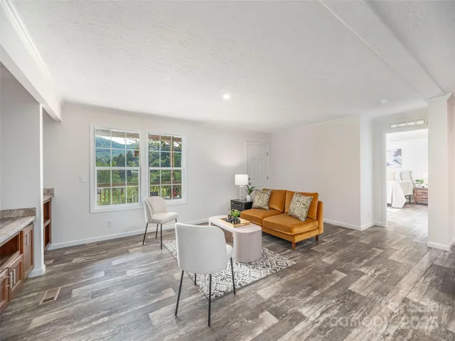 a living room with furniture and a table