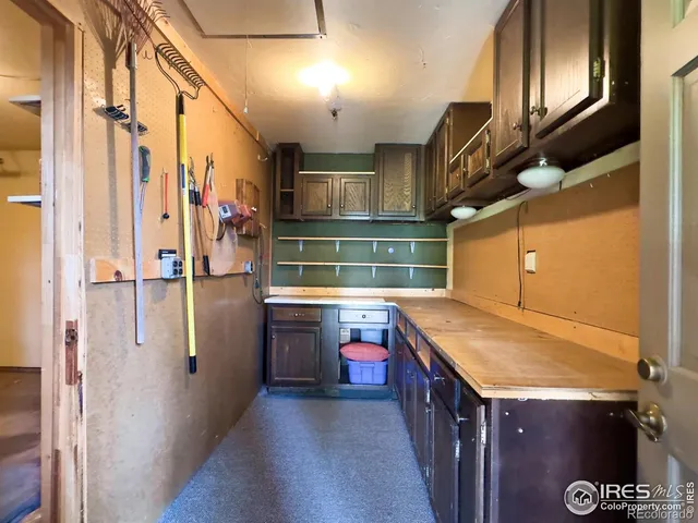 a kitchen with stainless steel appliances granite countertop a sink and a refrigerator