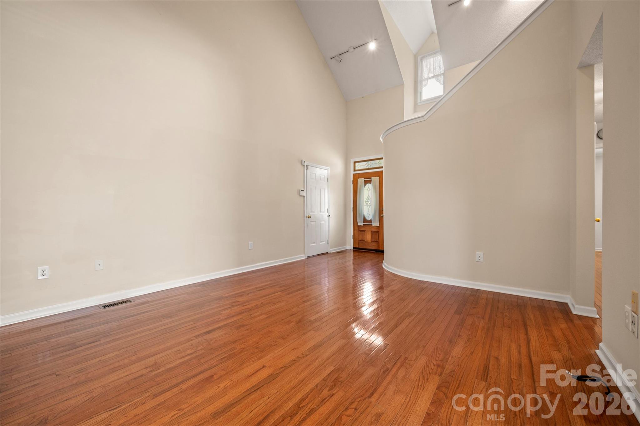 506 Pleasant Street Spindale, NC 28160 - Photo 8 of 42 a view of an empty room and wooden floor