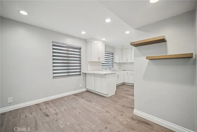 a view of kitchen and wooden floor