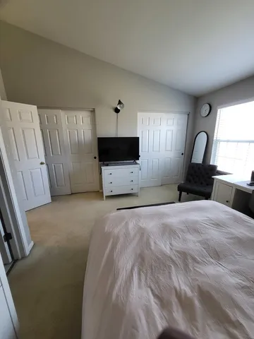 a view of a livingroom with furniture and staircase