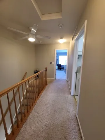 a view of a hallway with staircase