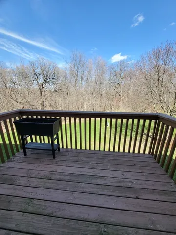 a view of a wooden roof with city view