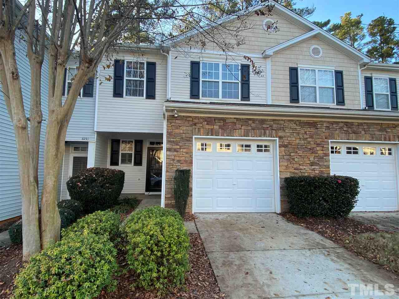 8235 Martello Lane Raleigh, NC 27613 - Photo 1 of 14 a front view of a house with glass windows