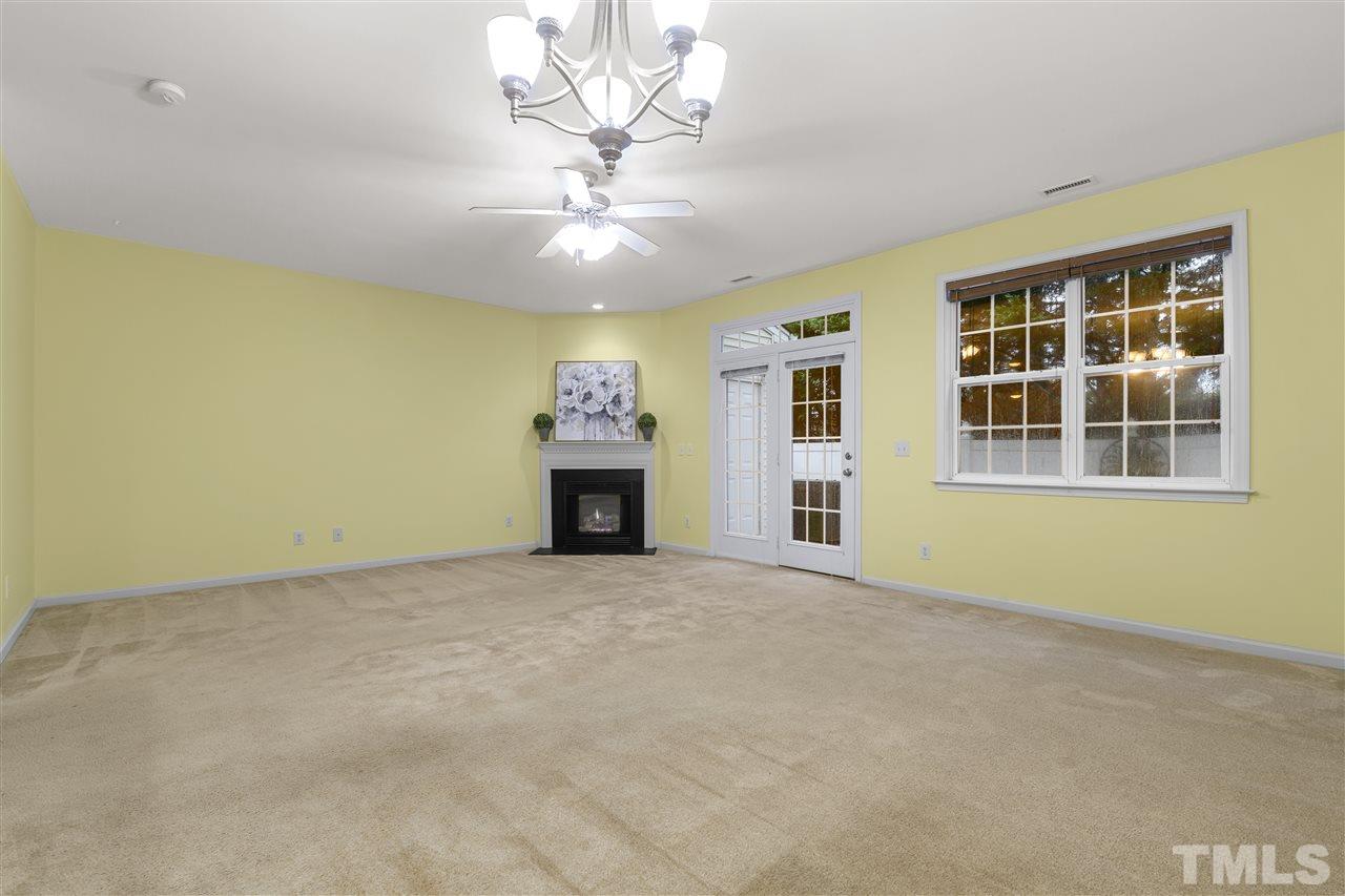 8235 Martello Lane Raleigh, NC 27613 - Photo 4 of 14 a view of an empty room with a window