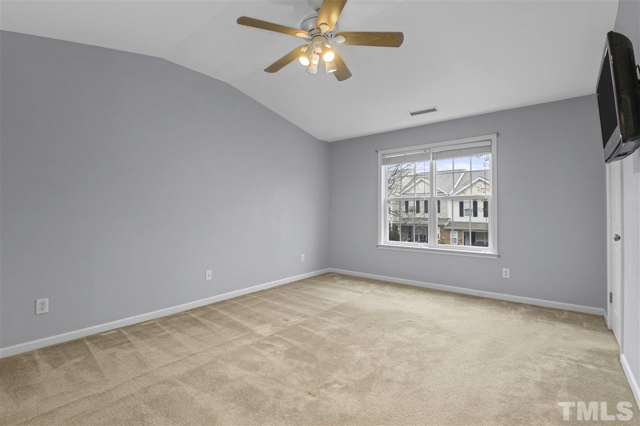 8235 Martello Lane Raleigh, NC 27613 - Photo 8 of 14 a view of an empty room with a window