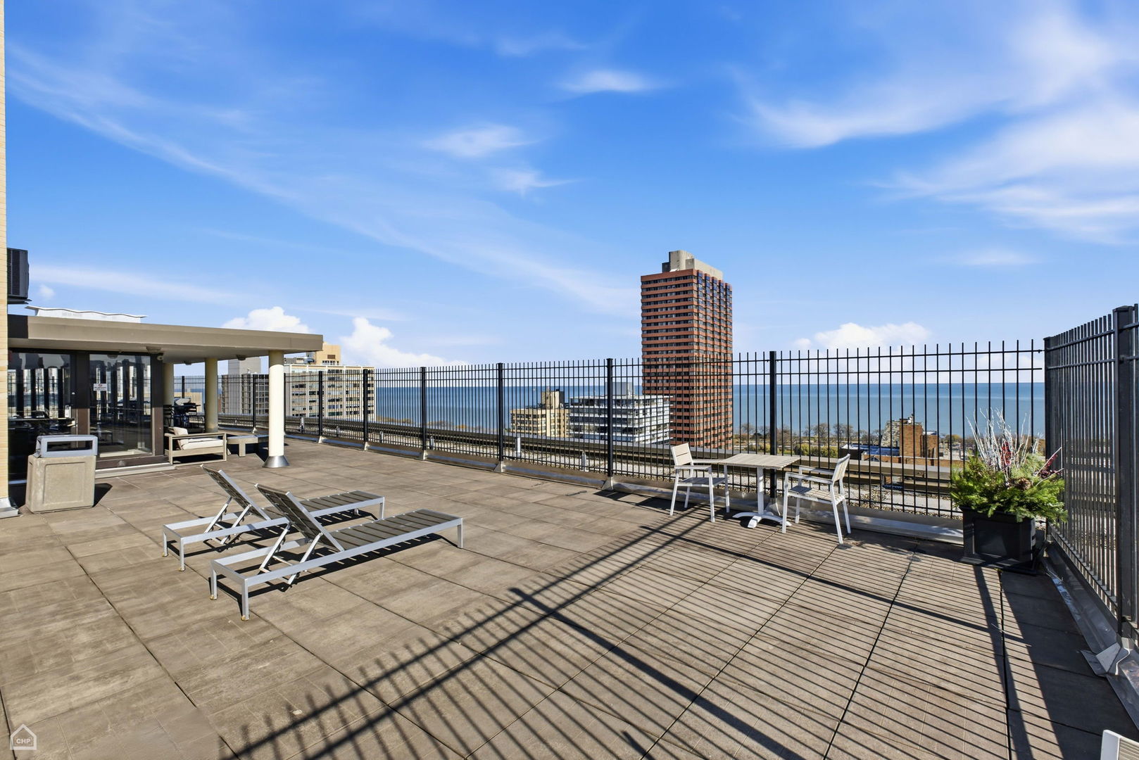 2930 North Sheridan Road, Unit 302 Chicago, IL 60657 - Photo 14 of 14 a view of a terrace with chairs