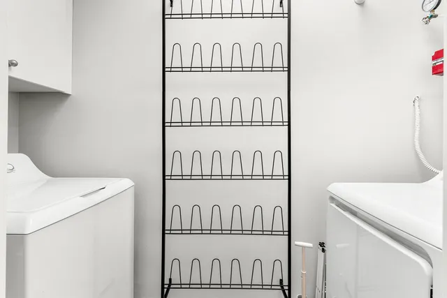 a bedroom with furniture and a flat tv screen