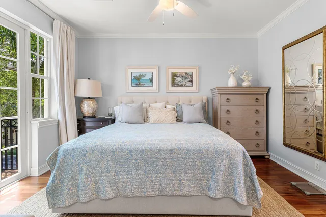 a bathroom with a granite countertop sink a toilet a mirror and shower
