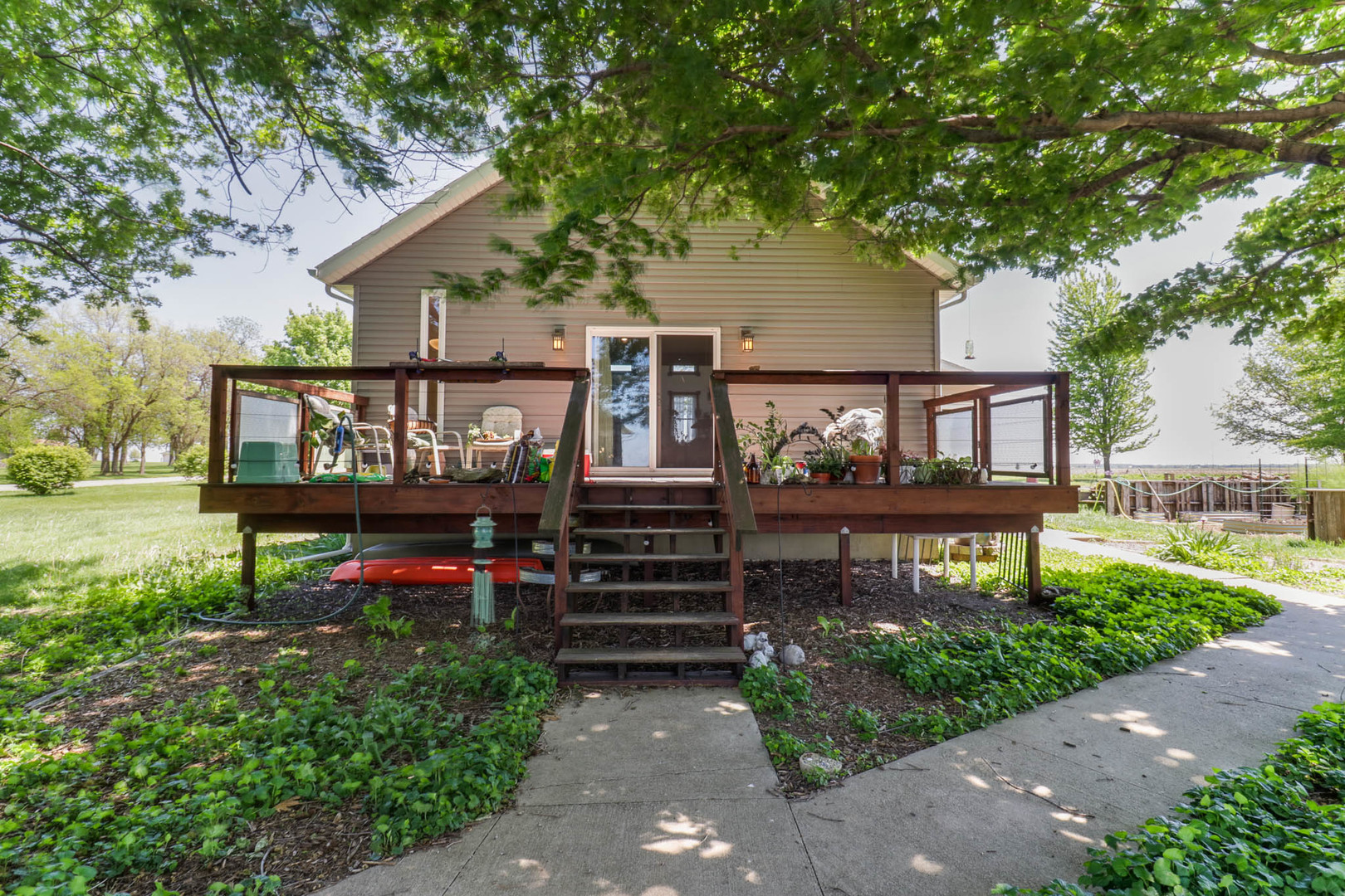 12014 Prairie Center Road Clinton, IL 61727 - Photo 39 of 56 a view of a bench in front of house