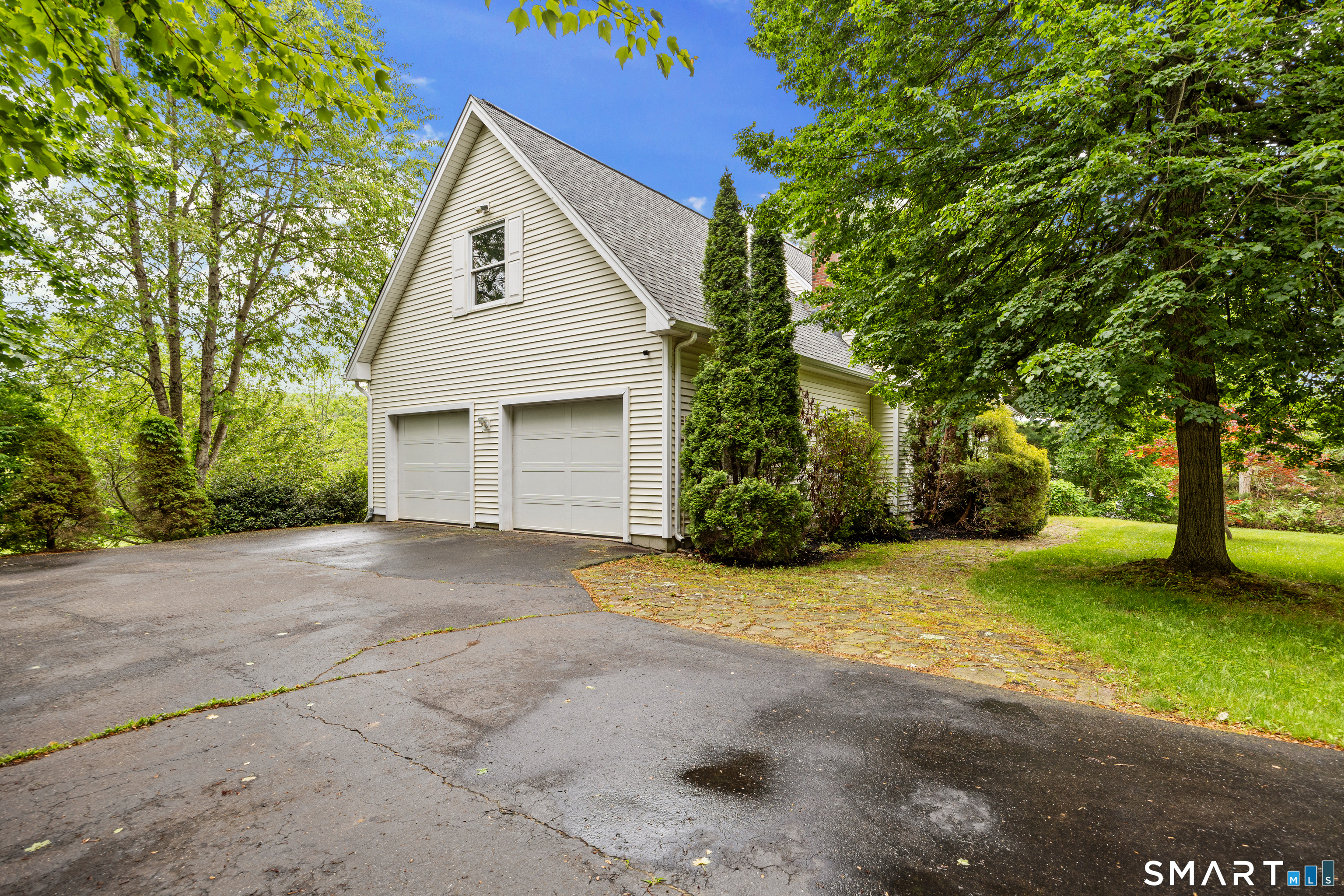 694 Millbrook Road Middletown, CT 06457 - Photo 31 of 34 a view of a house with a yard and large tree