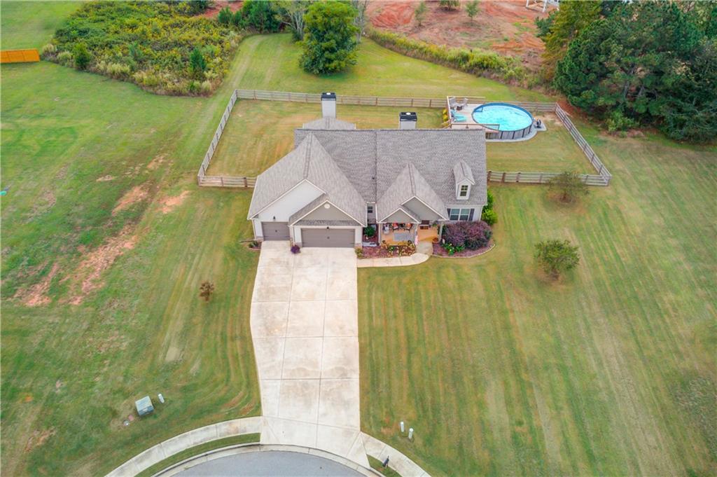612 Quail Court Good Hope, GA 30641 - Photo 1 of 40 an aerial view of a house with a yard