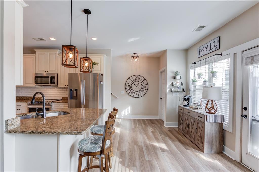 612 Quail Court Good Hope, GA 30641 - Photo 11 of 40 a very nice looking room with a large window and wooden floor