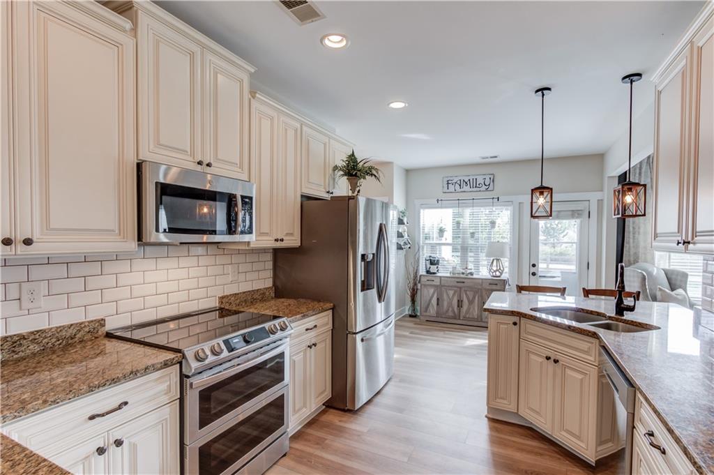 612 Quail Court Good Hope, GA 30641 - Photo 15 of 40 a kitchen with stove cabinets and refrigerator