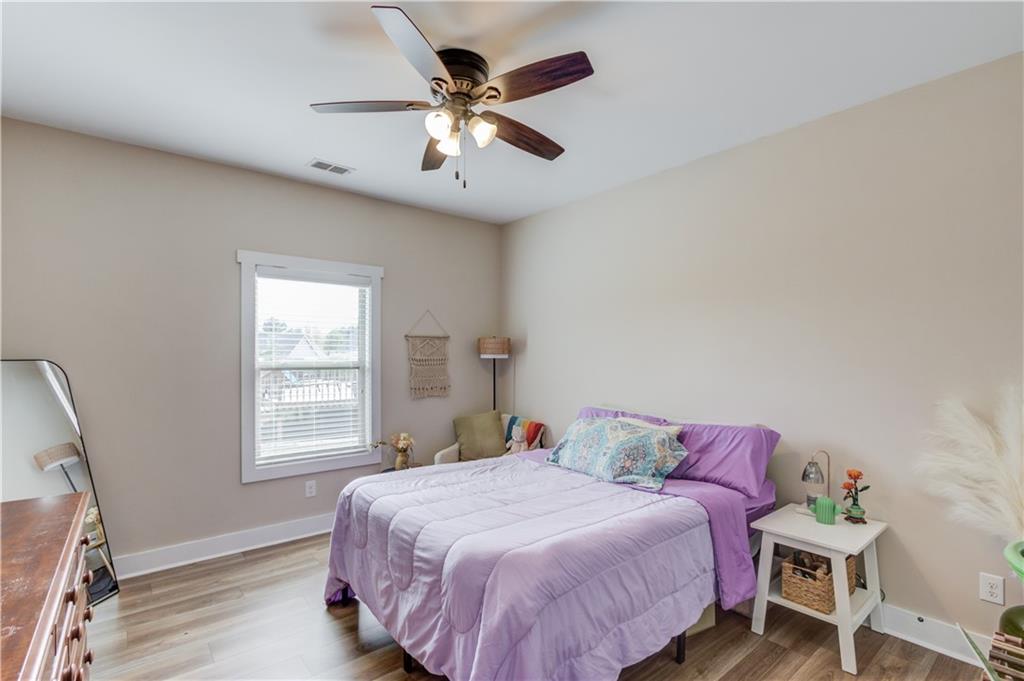 612 Quail Court Good Hope, GA 30641 - Photo 21 of 40 a bedroom with a bed and a window