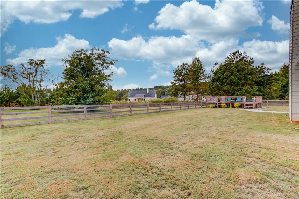 612 Quail Court Good Hope, GA 30641 - Photo 32 of 40 a view of swimming pool with outdoor seating and trees in the background