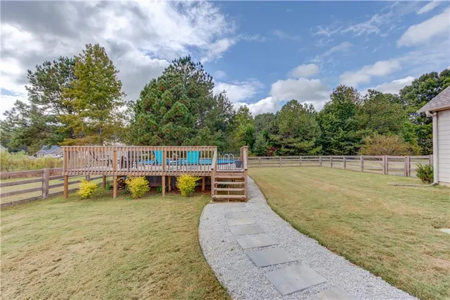 a view of a swimming pool with a patio
